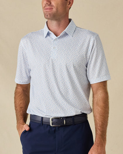 Model wearing the Hofbrau Polo in Blue Shade, featuring a subtle all-over novelty print and classic polo collar.