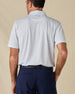 Back view of the Hofbrau Polo in Blue Shade, highlighting the all-over print and embroidered logo below the collar.