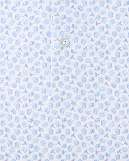 Close-up of the Hofbrau Polo in Blue Shade showing the detailed beer mug, pretzel, alpine hat, and sausage print with a branded button.
