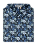 Folded black Hawaii 5.0 Polo featuring an allover blue and light green hibiscus floral print and button placket.