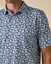 Close-up of the Point Reyes Polo in Mint Tea, highlighting the floral print, classic collar, and button placket.