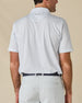 Back view of the Trader Vics Polo in Blue Shade, highlighting the all-over geometric print and embroidered logo below the collar.