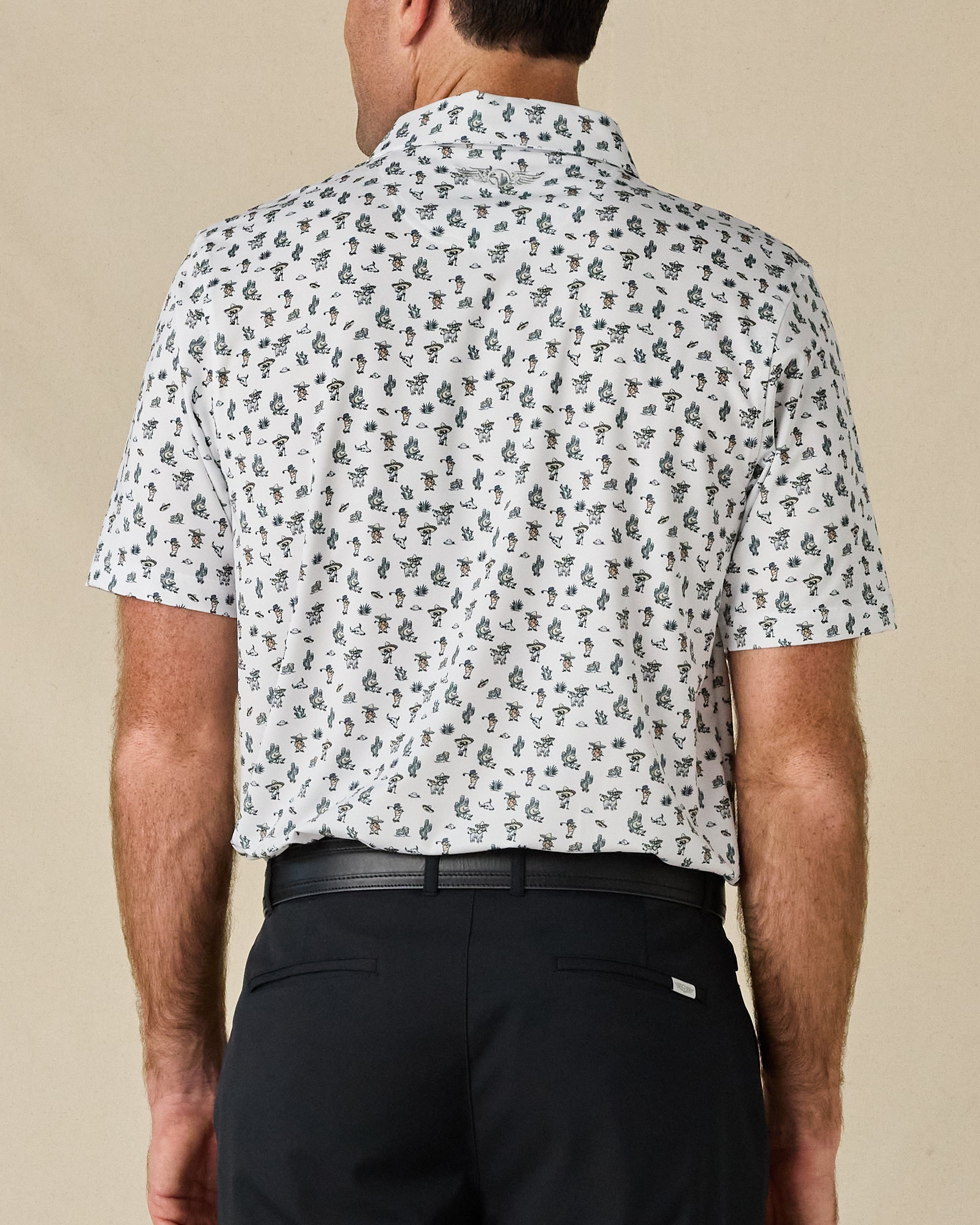 Rear view of the Siesta Polo in Herb, showing the all-over Western print and subtle embroidered logo below the collar.