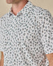 Close-up of the Siesta Polo in Herb, highlighting the detailed Western-inspired print and classic polo collar.