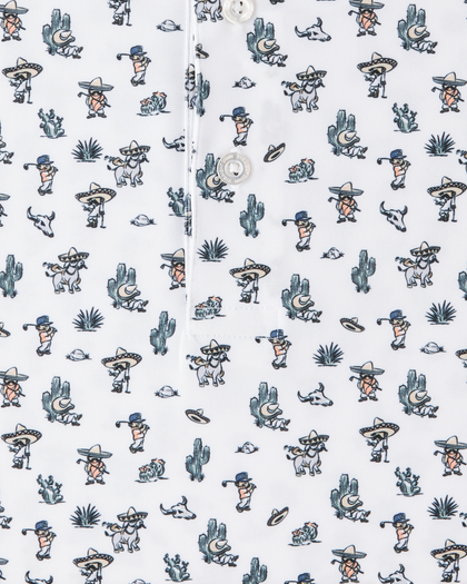 Close-up of the Siesta Polo showing the white fabric, button placket, and colorful Western-inspired print with golfers, cacti, and desert motifs.