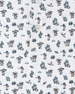 Close-up of the Siesta Polo showing the white fabric, button placket, and colorful Western-inspired print with golfers, cacti, and desert motifs.