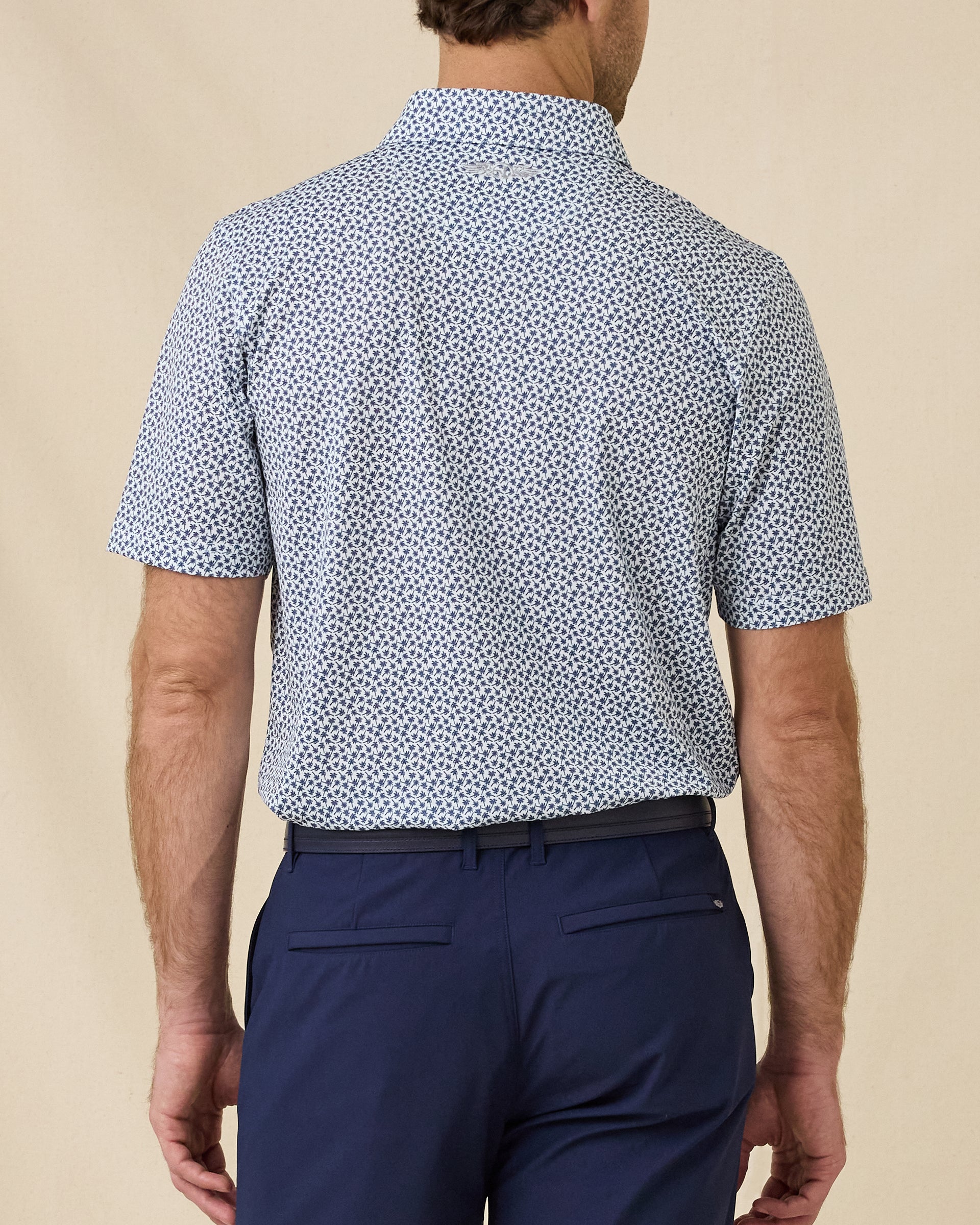 Back view of the Date Palm Polo in New Indigo featuring an allover navy palm tree print
