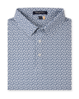 Folded Date Palm Polo in New Indigo with a white base, navy palm tree print, and three-button placket