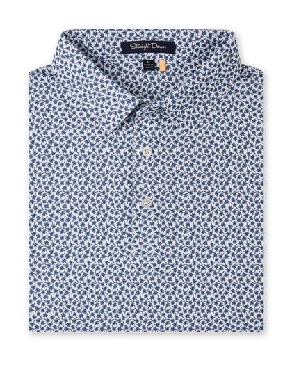 Folded Date Palm Polo in New Indigo with a white base, navy palm tree print, and three-button placket