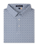 Folded Date Palm Polo in New Indigo with a white base, navy palm tree print, and three-button placket