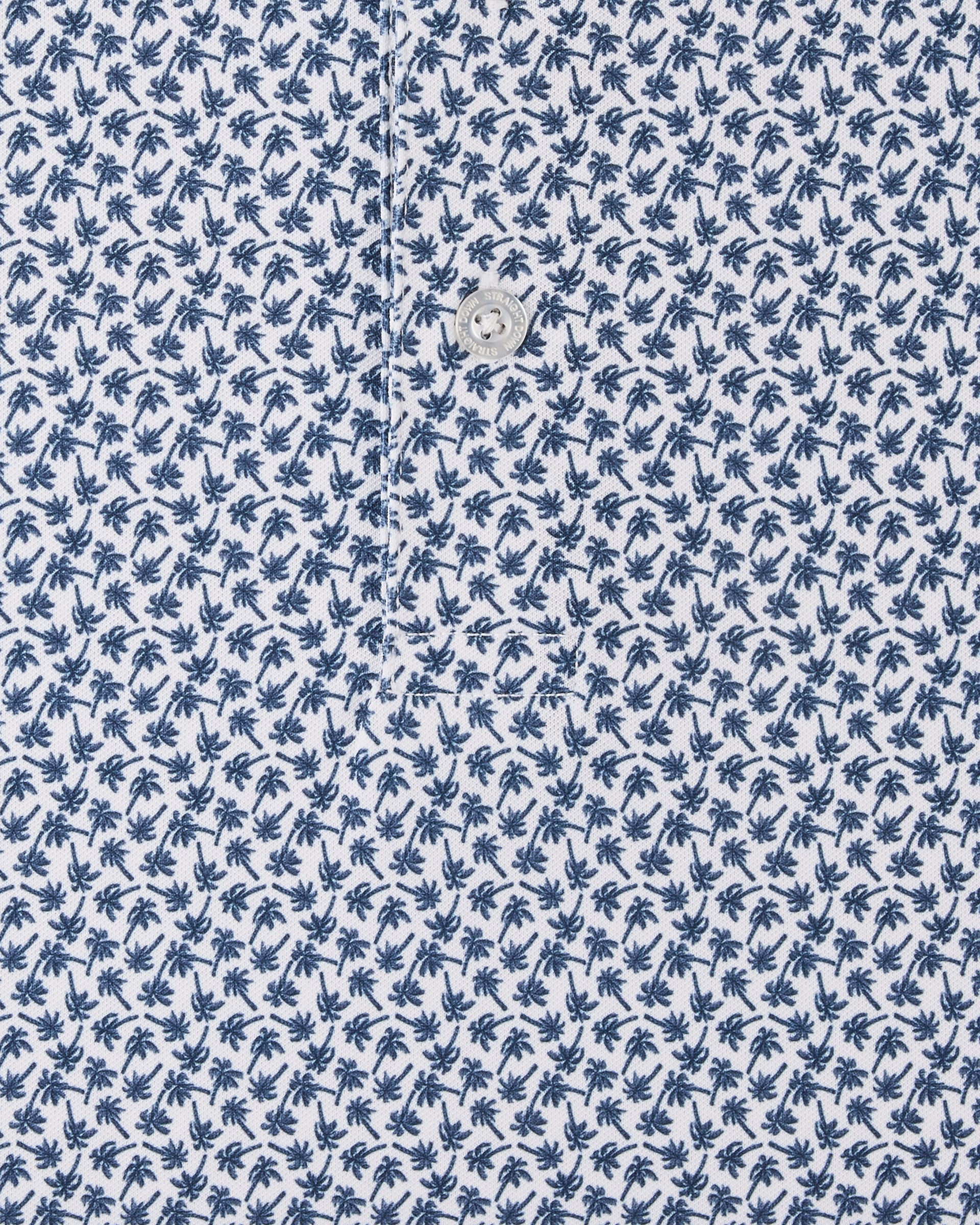 Close-up of the Date Palm Polo in New Indigo showcasing the allover navy palm tree print