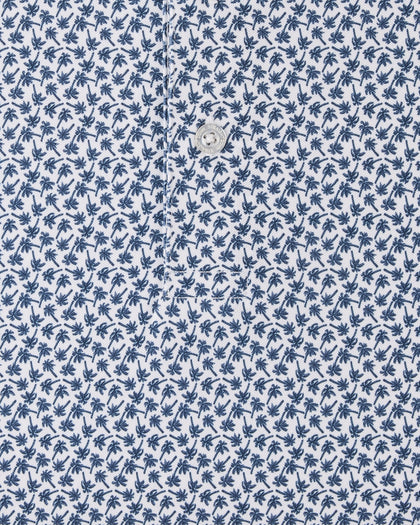 Close-up of the Date Palm Polo in New Indigo showcasing the allover navy palm tree print