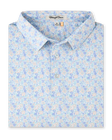 Folded Pasadena Polo in Lake featuring an all-over floral print in soft blue, lavender, aqua, and peach tones.