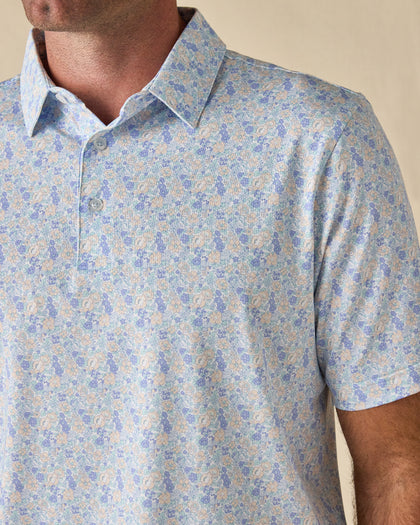 Close-up of the Pasadena Polo in Lake, highlighting the intricate floral print, classic collar, and button placket.