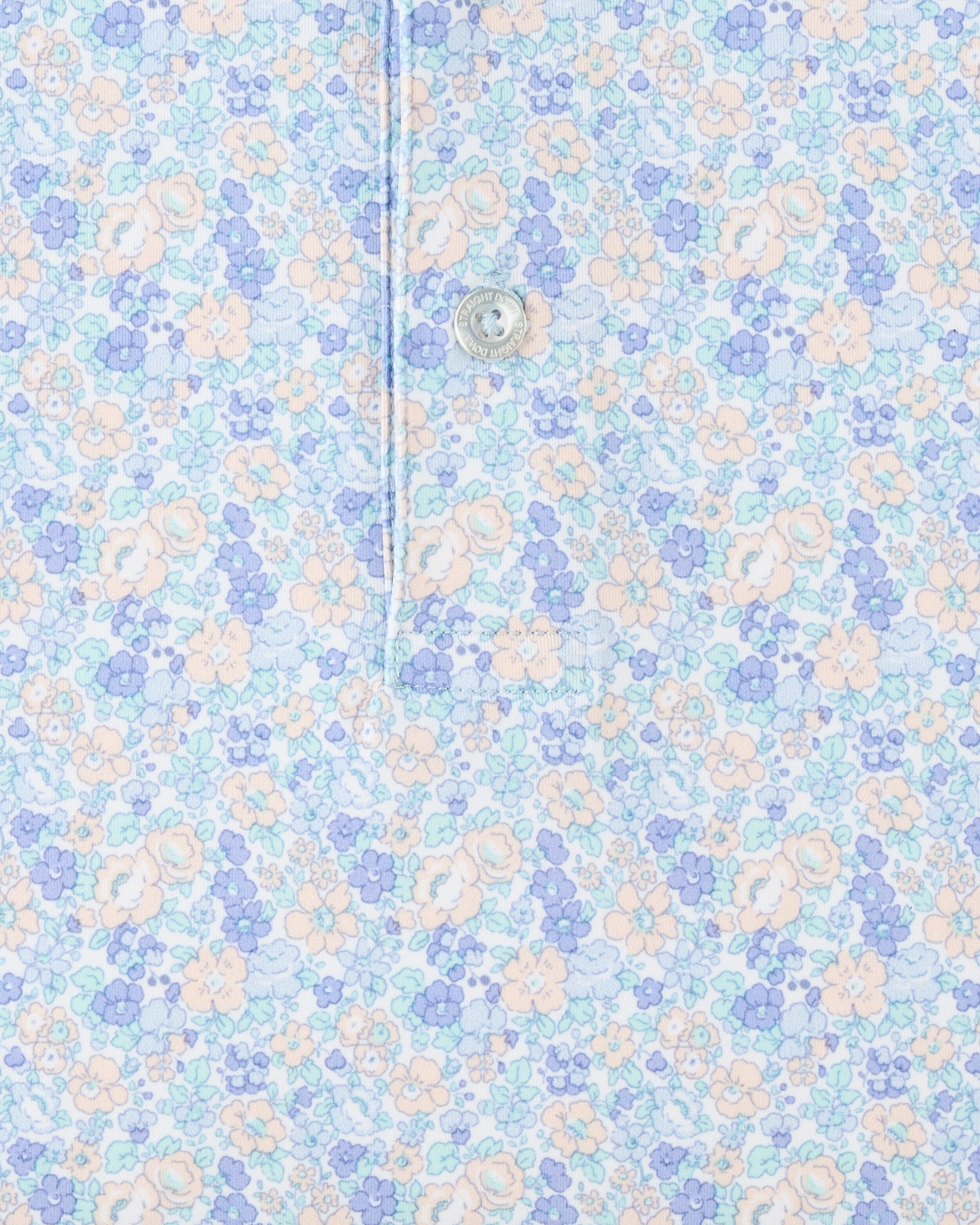 Close-up of the Pasadena Polo in Lake highlighting the floral print, button placket, and fabric detail.