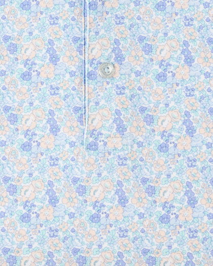 Close-up of the Pasadena Polo in Lake highlighting the floral print, button placket, and fabric detail.