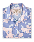 Folded blue short-sleeve shirt with a pink floral print, pearl snap buttons and dual chest pockets.