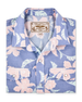 Folded blue short-sleeve shirt with a pink floral print, pearl snap buttons and dual chest pockets.