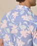 Close-up of the back collar and floral print on the blue short-sleeve shirt.