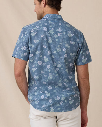 Rear view of the Celadine Woven Shirt showing the allover floral print and short-sleeve fit.