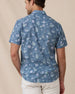 Rear view of the Celadine Woven Shirt showing the allover floral print and short-sleeve fit.
