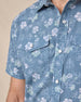 Close-up of the Celadine Woven Shirt showing the floral print, pearl snap buttons, and chest pocket.