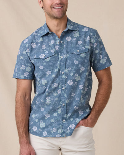 Model wearing the Celadine Woven Shirt in Moonlight with light beige pants.