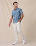 Model wearing the Celadine Woven Shirt in Moonlight with light beige pants and white sneakers.