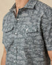 Close-up of the Out West Woven Shirt showing the western print, pearl snap buttons, and chest pockets.