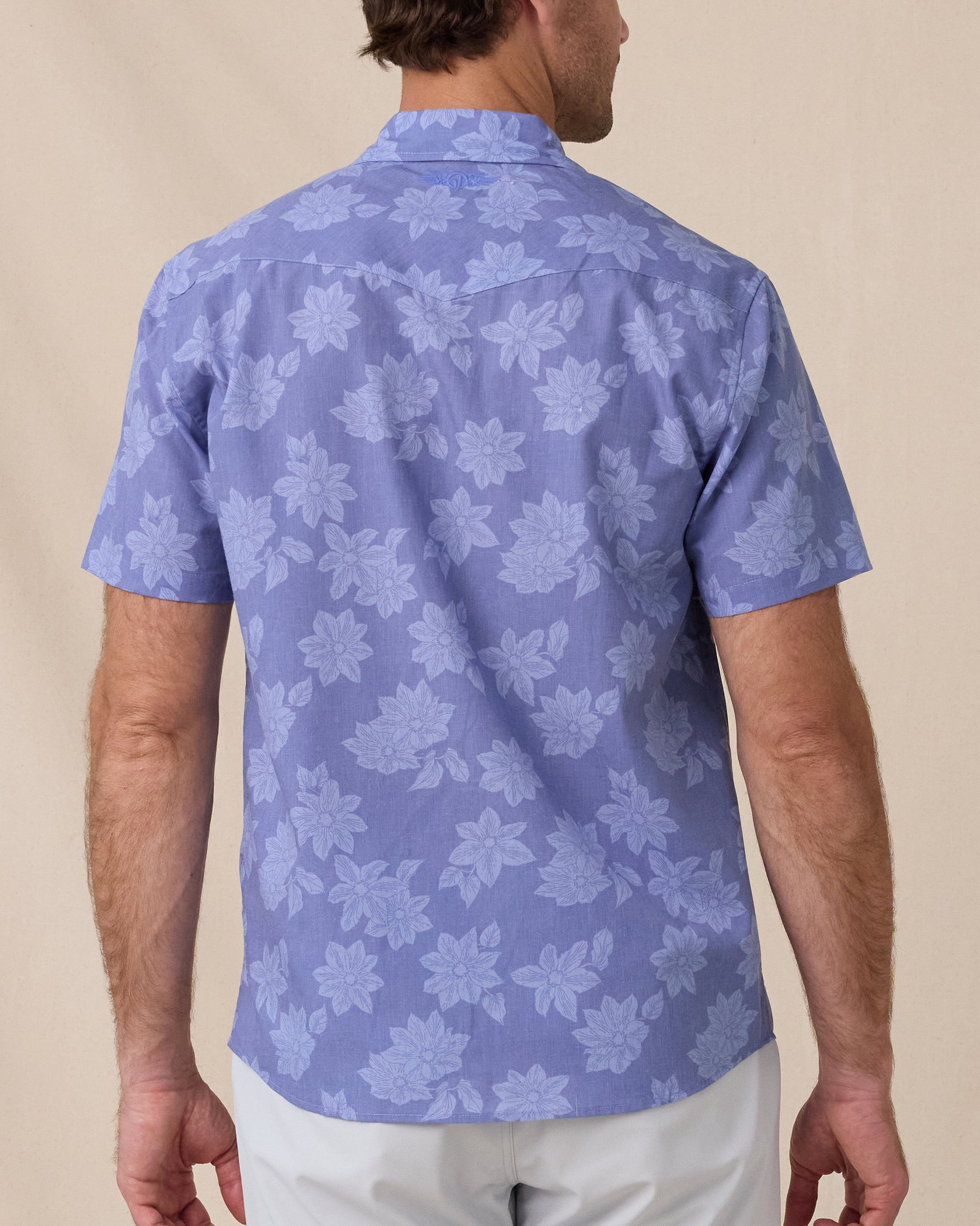 Back view of the Treviso Bay Woven Shirt in Tidal Blue highlighting the allover tonal floral print