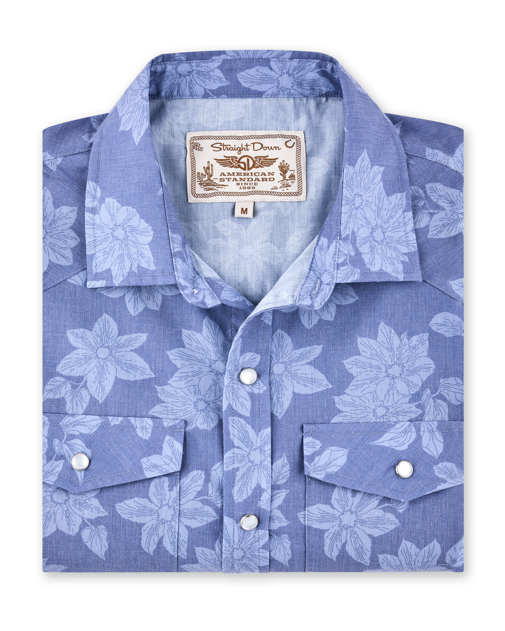 Treviso Bay Woven Shirt in Tidal Blue folded view featuring a tonal floral print, western yoke detailing, and pearl snap buttons
