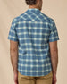 Back view of the Jasper Woven Shirt in Moonlight showing the plaid pattern, western yoke, and embroidered logo below the collar.