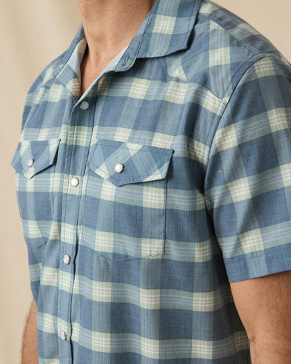 Close-up of the Jasper Woven Shirt in Moonlight showing the plaid pattern, pearl snap buttons, western yoke, and flap chest pockets.