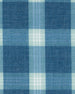 Close-up of the Jasper Woven Shirt fabric showing the blue and light green plaid pattern and woven texture.