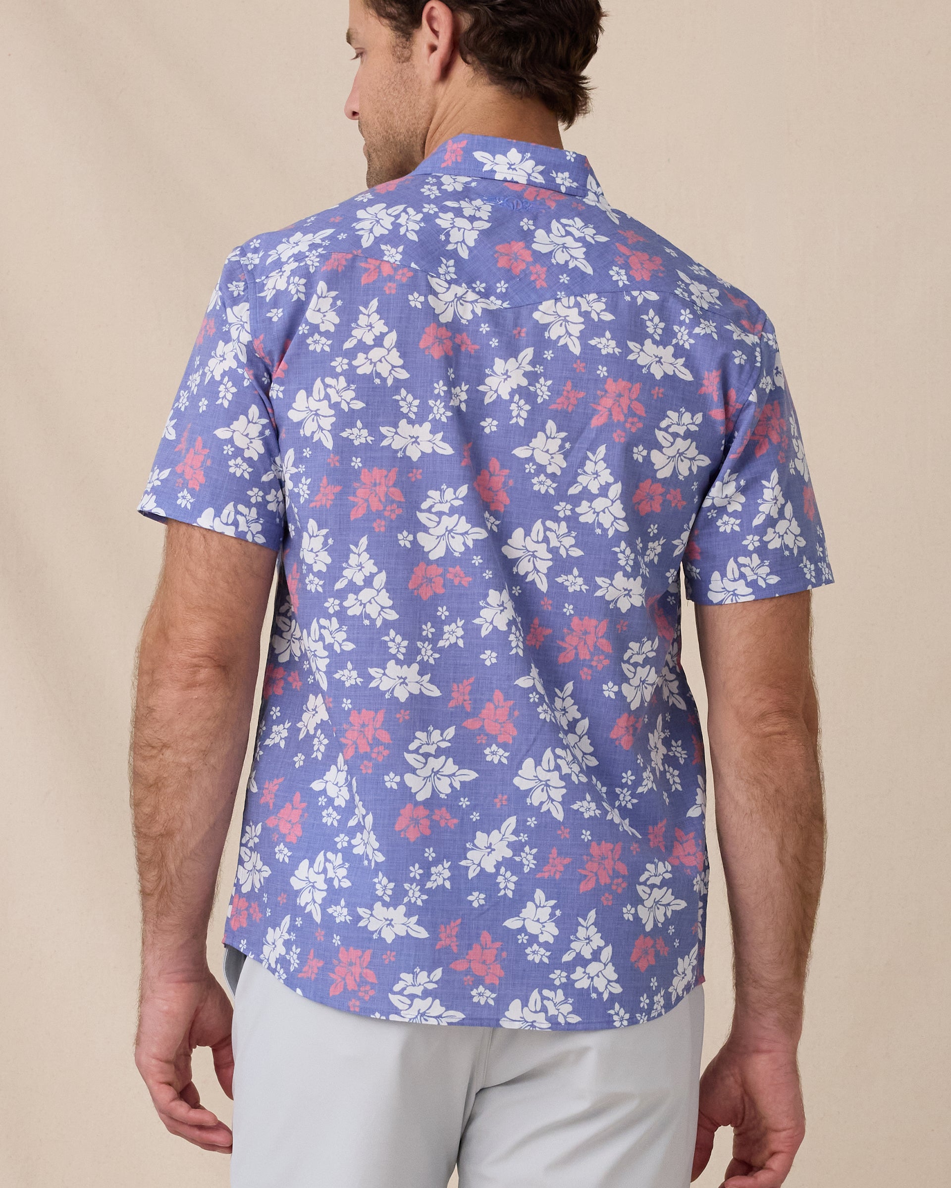 Back view of the Paniolo Woven Shirt in Tidal Blue featuring an allover hibiscus floral print and western-inspired yoke