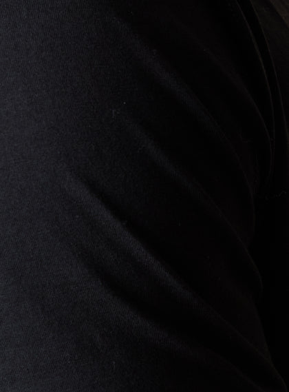 Men's Luxe Tee in Black, close up fabric view featuring a black short sleeve crew neck tee