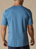 Men's Luxe Tee in Petrol, on model back view featuring a medium blue short sleeve crew neck tee 