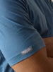 Men's Luxe Tee in Petrol, on model close up sleeve view featuring a medium blue short sleeve crew neck tee 