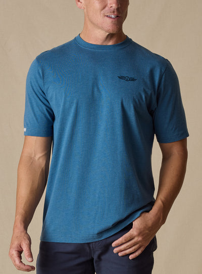 Vegas Vacation Graphic Tee in Petrol, front model view featuring a heathered blue short-sleeve crewneck tee with a Straight Down logo at the left chest, paired with navy pants