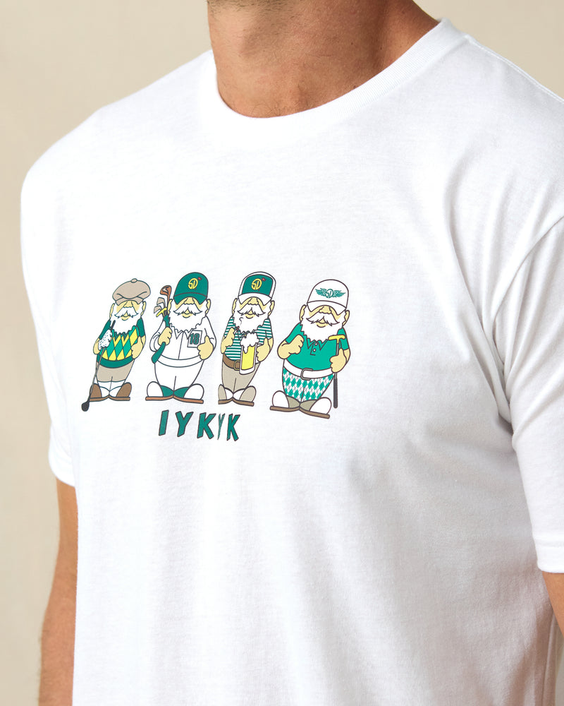 Men's IYKYK Tee in White, close-up front view on model highlighting the four golf gnome characters in green and gold with IYKYK text below