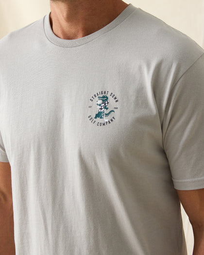 Men's Alligator Alley Tee in Light Grey, close-up model view featuring the Straight Down Golf Company Est. 1989 alligator graphic on the left chest