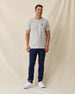Men's Alligator Alley Tee in Light Grey, full length model view featuring a light grey short sleeve crewneck tee with the Straight Down Golf Company Est. 1989 alligator graphic paired with navy pants and white shoes