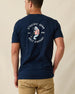Men's Mana-Tee in Navy, back view on model featuring a large circular Straight Down Golf Company Est. 1989 graphic with cigar-smoking manatee holding a golf club, paired with khaki pants