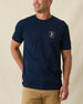 Men's Mana-Tee in Navy, front view on model featuring a small circular Straight Down Golf Company Est. 1989 graphic with manatee character on left chest, paired with khaki pants