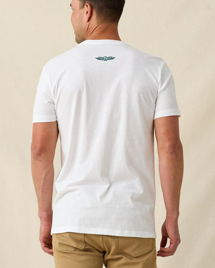 Men's Munch Tee in White, back view on model featuring a white base with a small Straight Down logo at upper back, paired with khaki pants