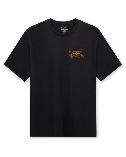 American Standard Tee in Black featuring a small gold western-inspired Straight Down graphic on the left chest.