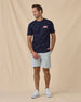 Free & Brave Tee in Navy, styled full outfit view with light shorts
