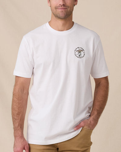 Man wearing the Old El Paso Tee in White with a small western-inspired golfer graphic on the left chest.