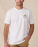 Man wearing the Old El Paso Tee in White with a small western-inspired golfer graphic on the left chest.
