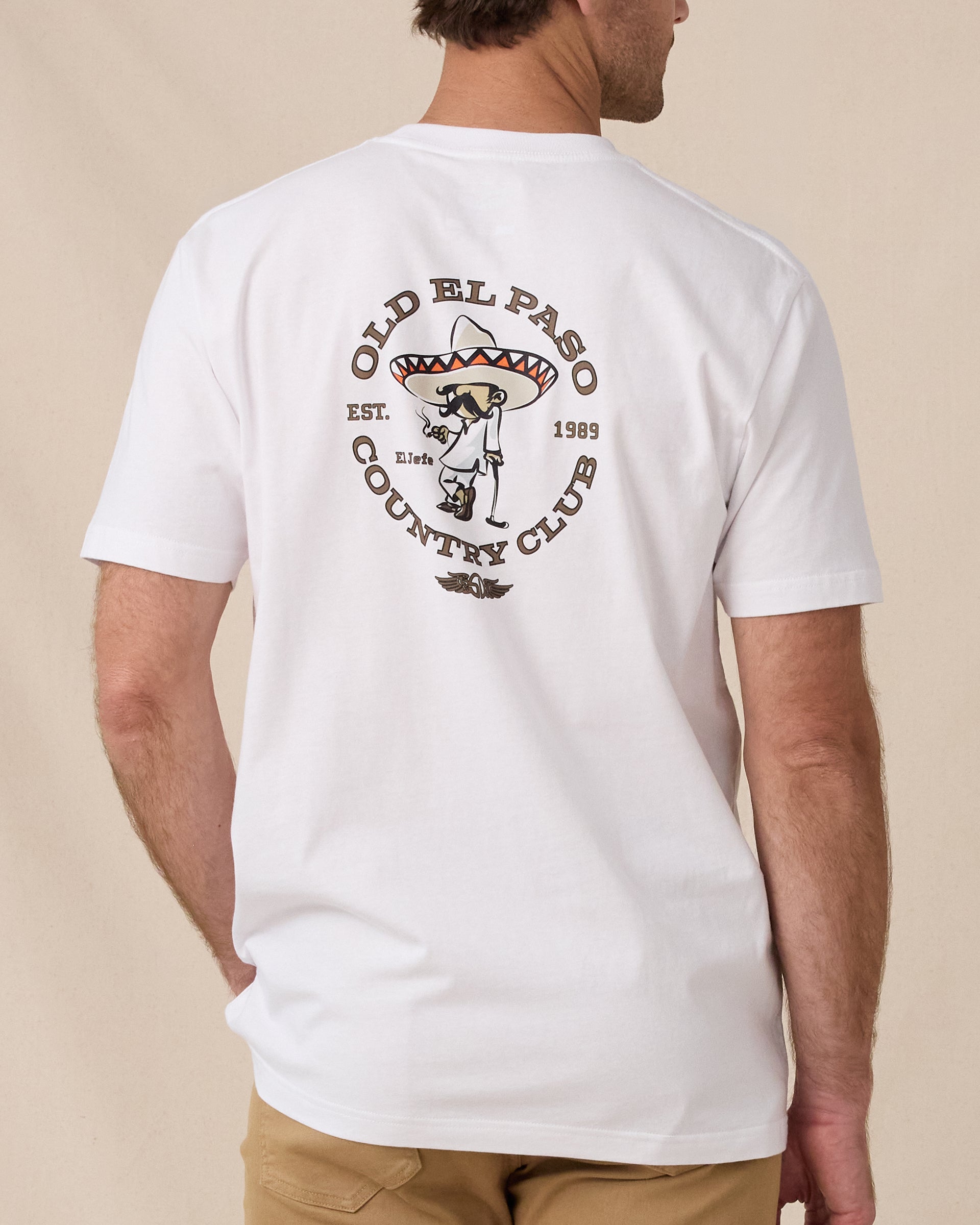 Back view of the Old El Paso Tee in White featuring a large Old El Paso Country Club golfer graphic.